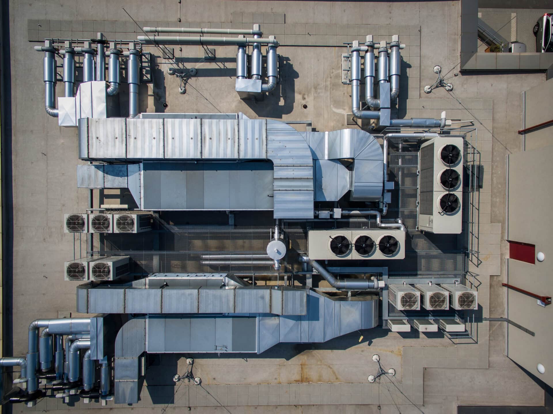 Air conditioning system on the roof of the building, advanced air conditioning and ventilation system, aerial view down the roof of the house, many different ventilation ducts